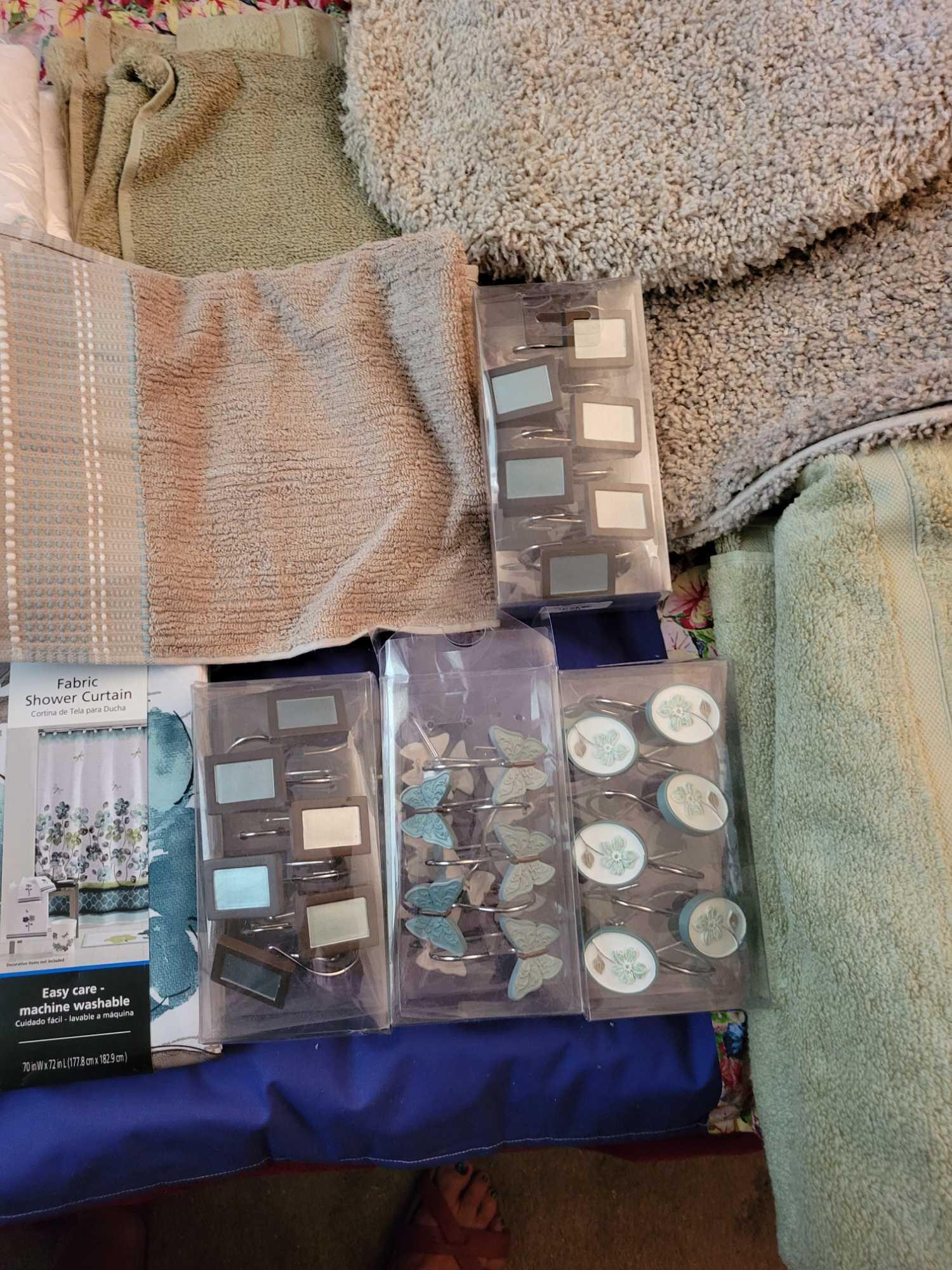 New Bathroom rugs towels Shower curtains and hooks . Sage and tan