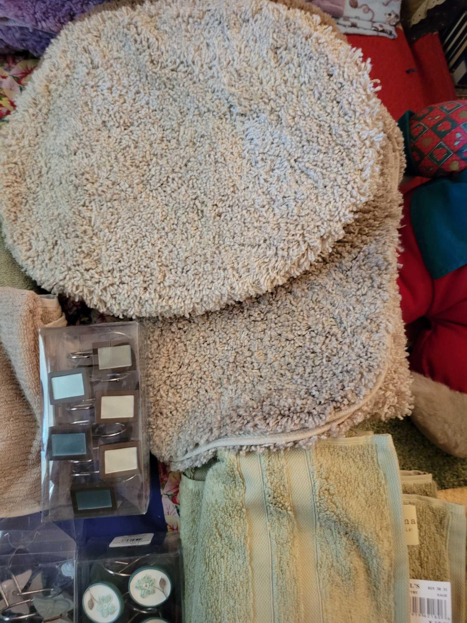 New Bathroom rugs towels Shower curtains and hooks . Sage and tan