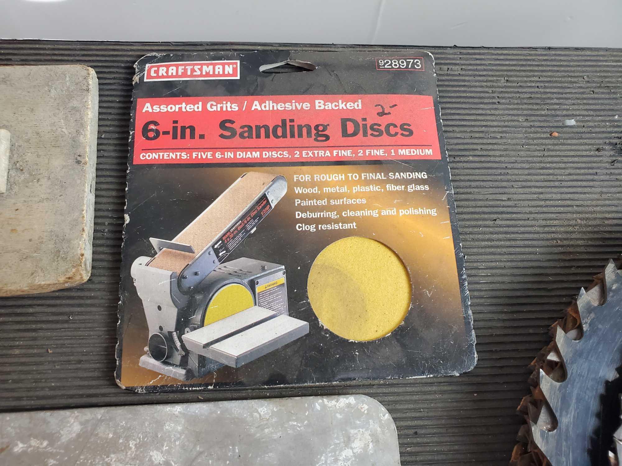 Concrete tools. New and used saw blades. 6 in. sanding discs.