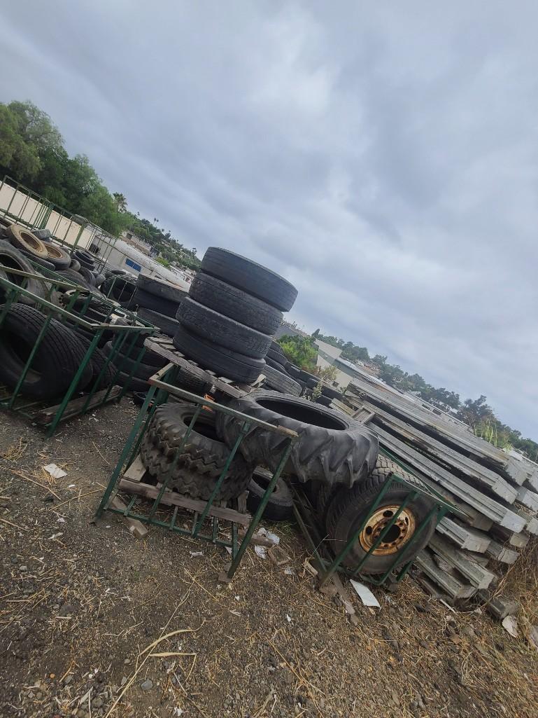 Tire Carriers Man Lift and Giant pile of tires - every size!