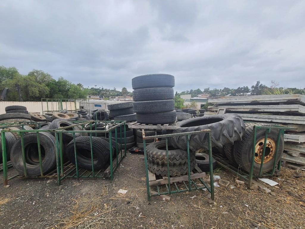 Tire Carriers Man Lift and Giant pile of tires - every size!