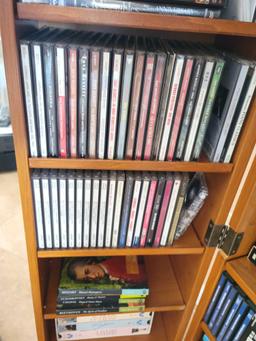 CDs Dvds Vhs Movies and music w Cabinet