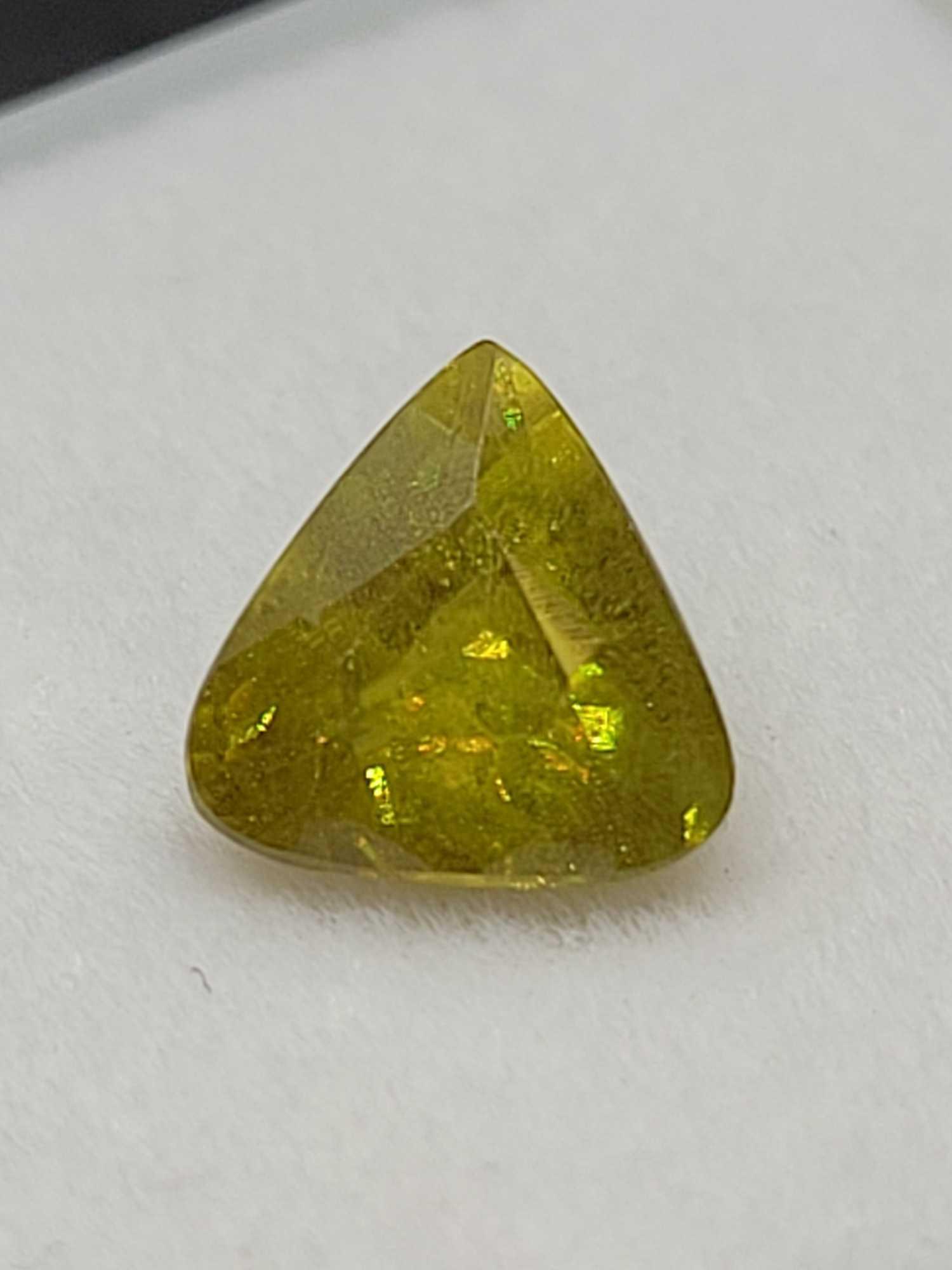 1.38ct green sphene earth mined gemstone Stunning orange color trillion cut