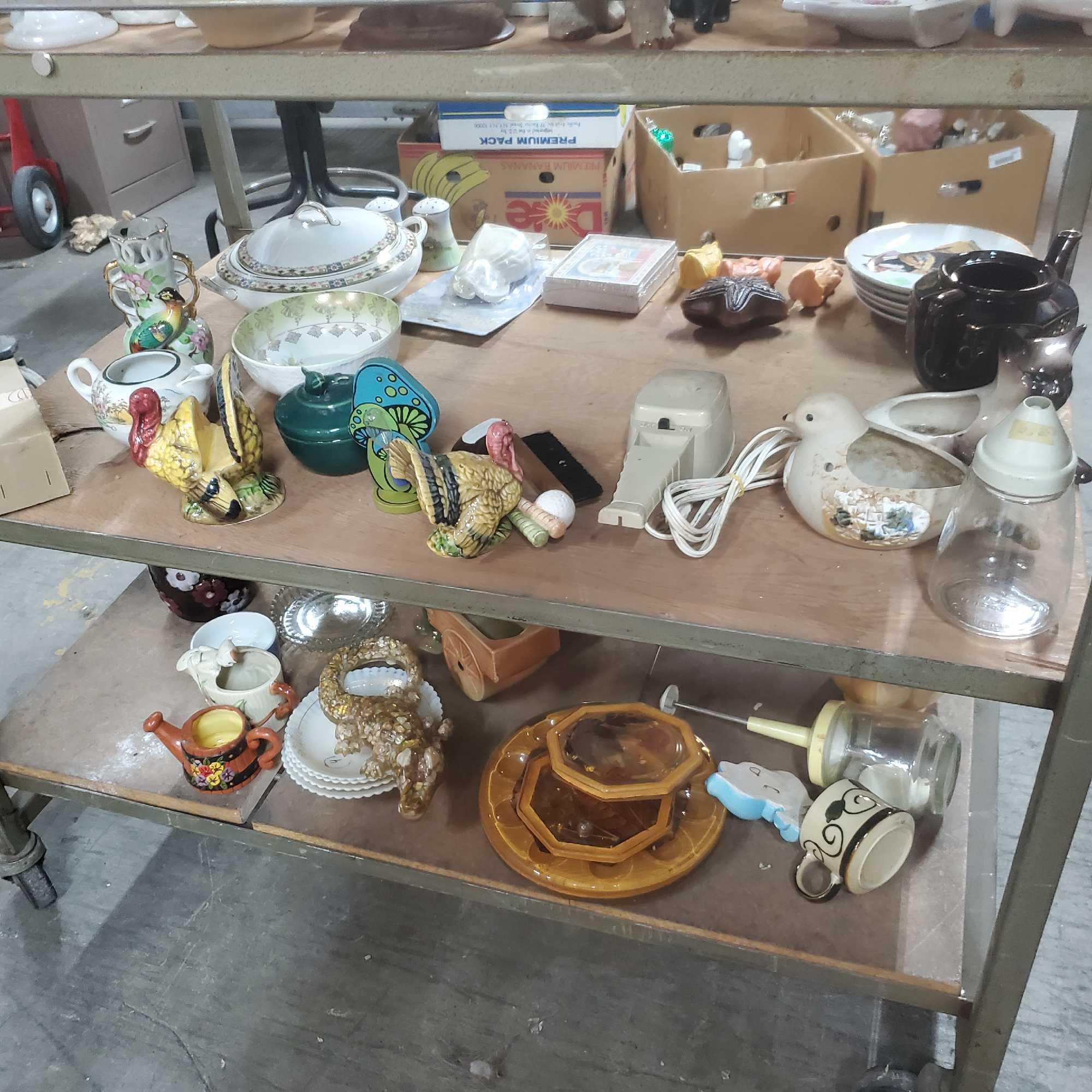 Shelf of vintage ceramic figures oil lamps salt and pepper shakers Goodwill Location