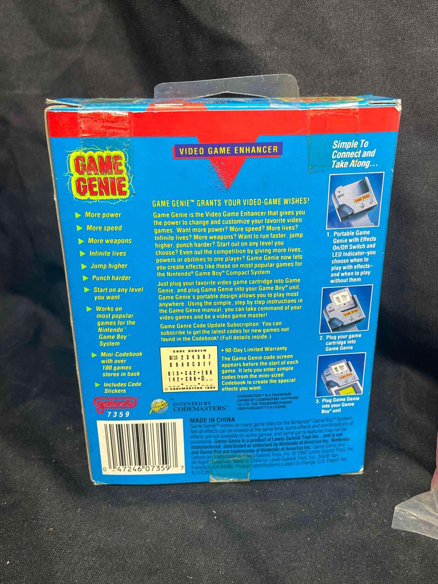 Gameboy System with Games and Game Genie. Nintendo Game Boxes and Manuals