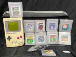 Gameboy System with Games and Game Genie. Nintendo Game Boxes and Manuals