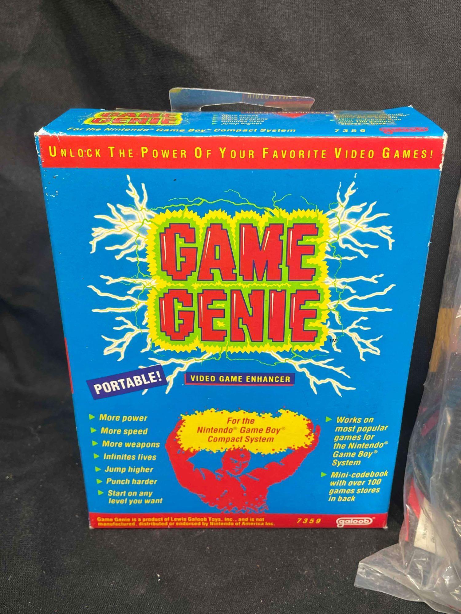 Gameboy System with Games and Game Genie. Nintendo Game Boxes and Manuals