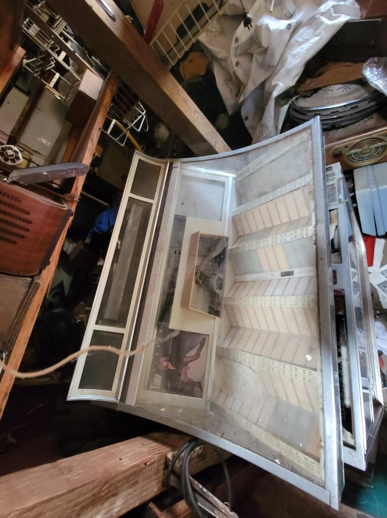 storage unit contents - wurlitzer jukeboxes, radios bulbs etc.