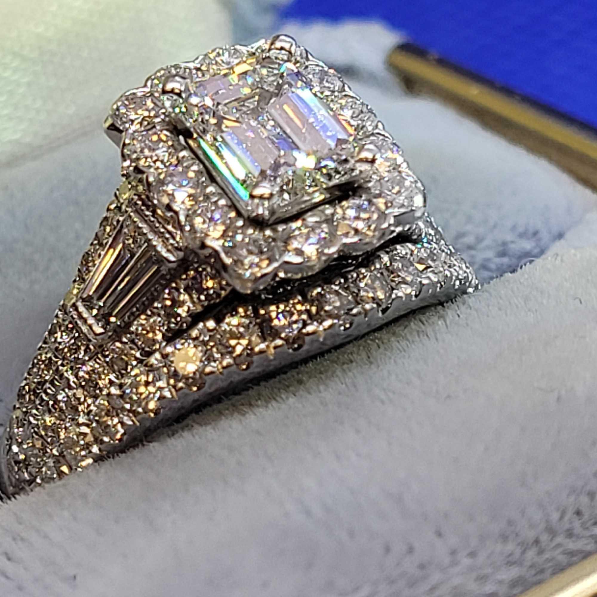 1ct center stone Emerald Cut VVS2 2kt+ total diamond total weight and band white gold neil lane GIA