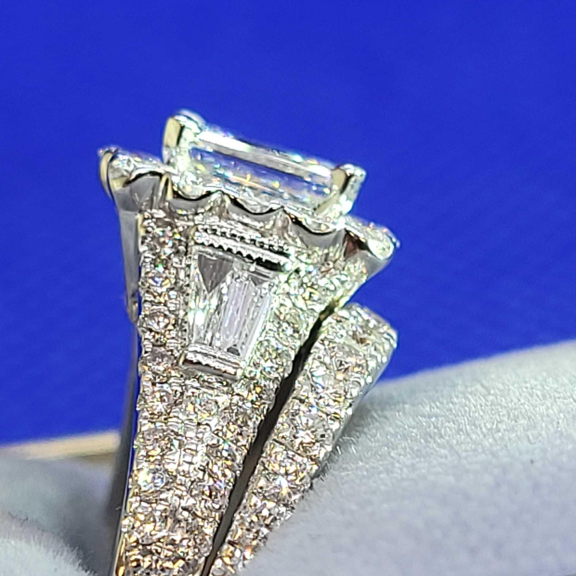 1ct center stone Emerald Cut VVS2 2kt+ total diamond total weight and band white gold neil lane GIA