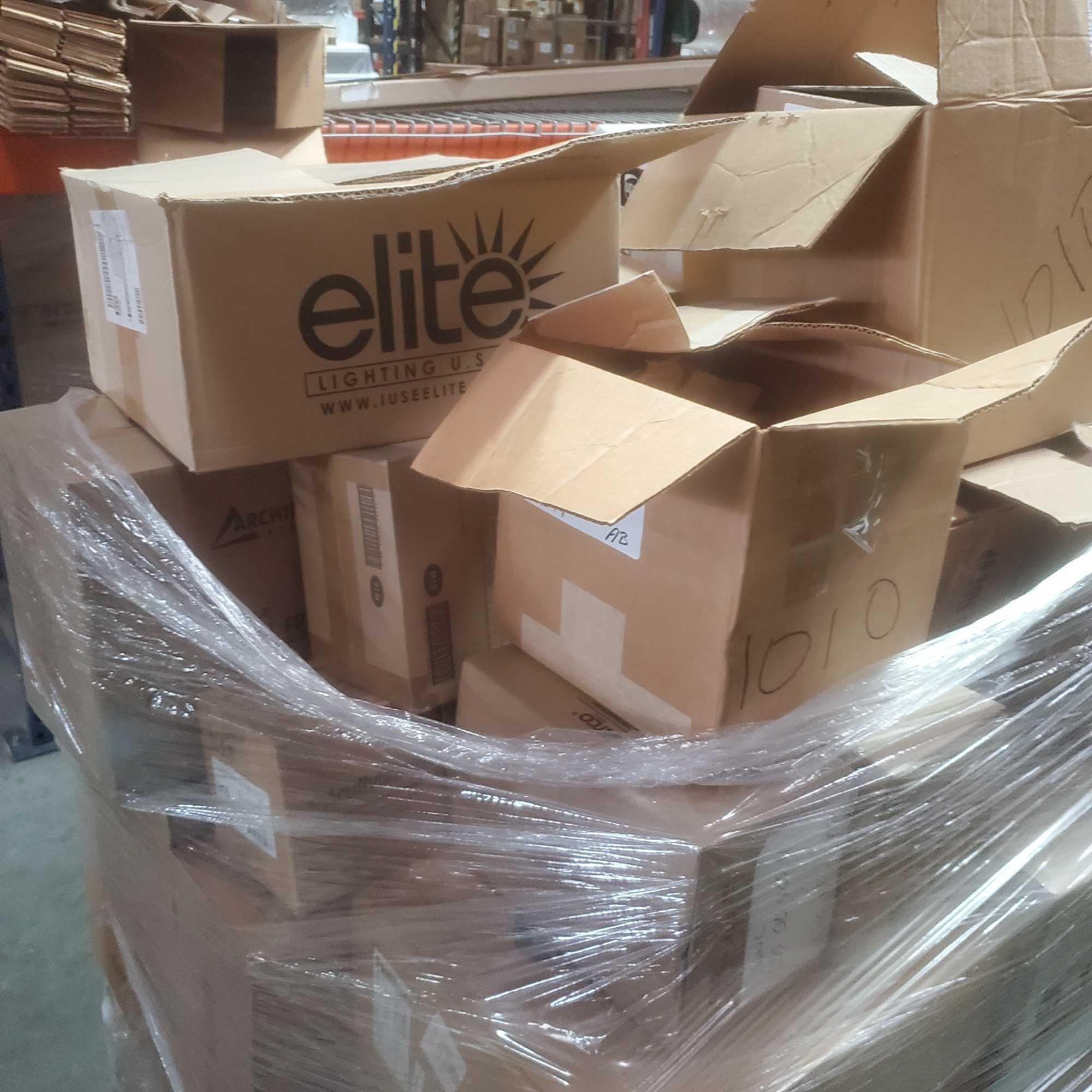 Pallet of tech recessed lighting bulbs and hardware