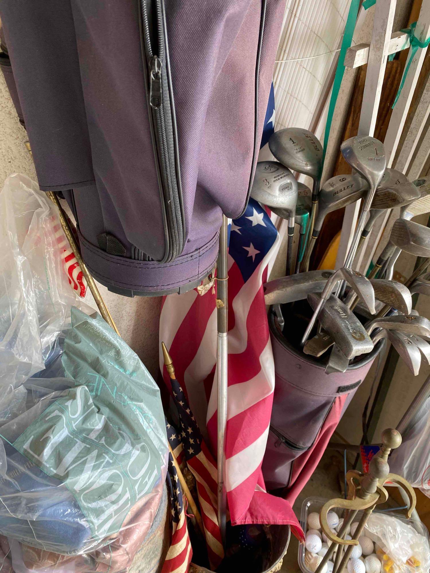 Corner of garage stuff random items, rugs, fabric bolt, golf, bbq, flag, etc.