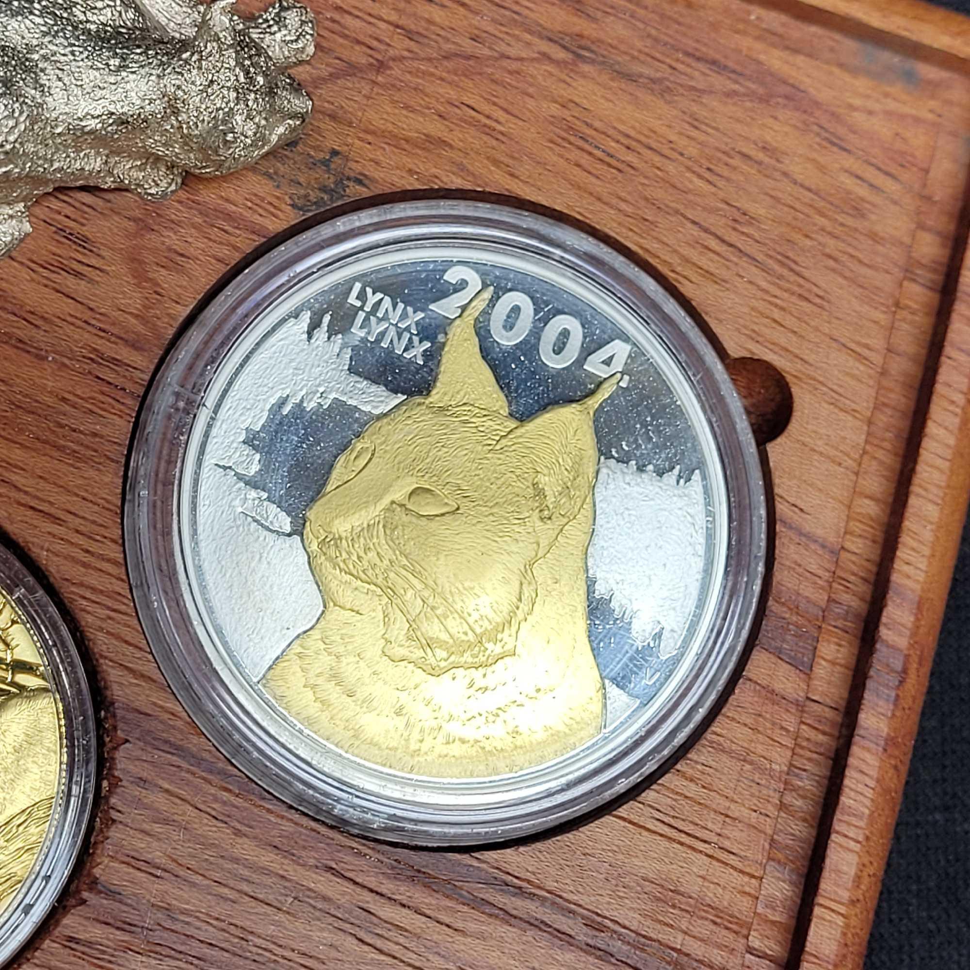2004 Natura Launch set 24kt gold coin with silver coin and silver Lynx