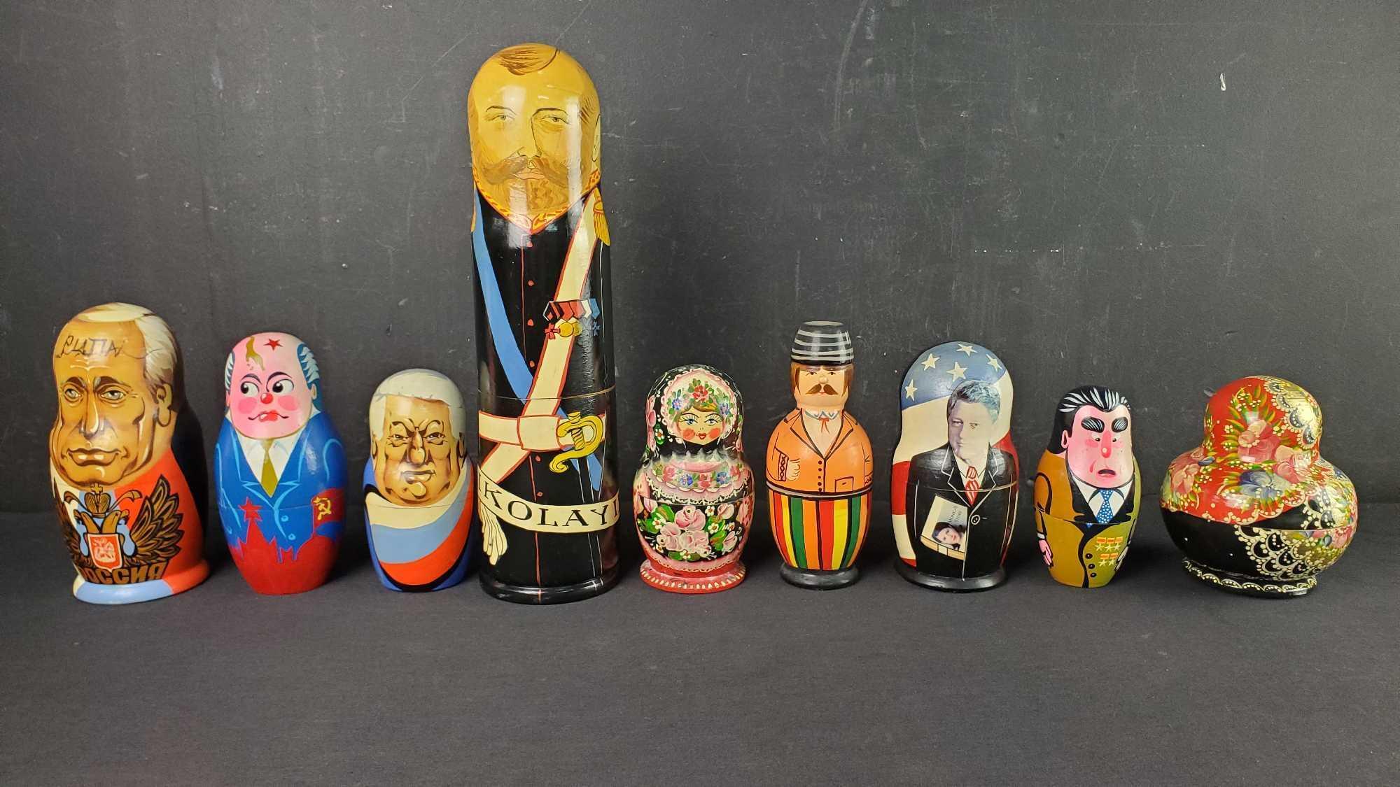 Lot of 9 various nesting dolls some with signatures Nikolay Clinton Putin more