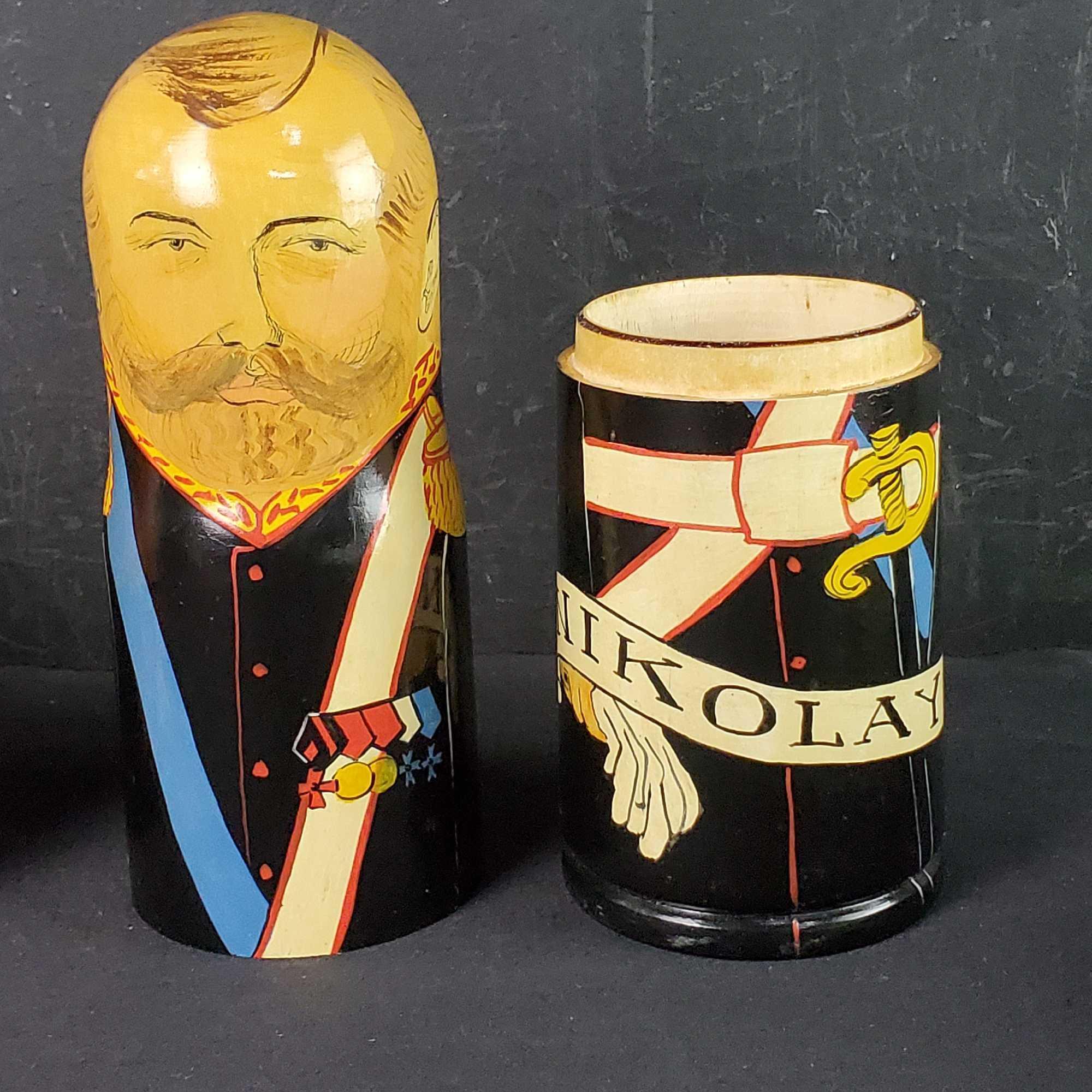 Lot of 9 various nesting dolls some with signatures Nikolay Clinton Putin more