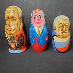 Lot of 9 various nesting dolls some with signatures Nikolay Clinton Putin more