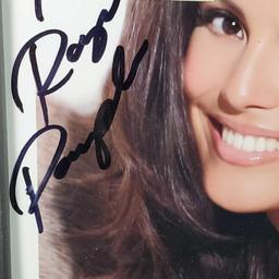 Framed and signed portrait photo of Raquel Pomplun with 5 dollar bill signed