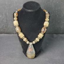 Unique beaded and shell disc necklace with large stone like pendant