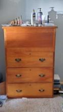 Large wooden dresser with clothing/contents