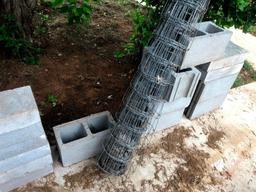 9 Concrete Blocks, 8 Solid Blocks & 1 Roll Wire