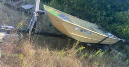 14 foot flat bottom boat and trailer. Has title....