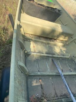 14 foot flat bottom boat and trailer. Has title....