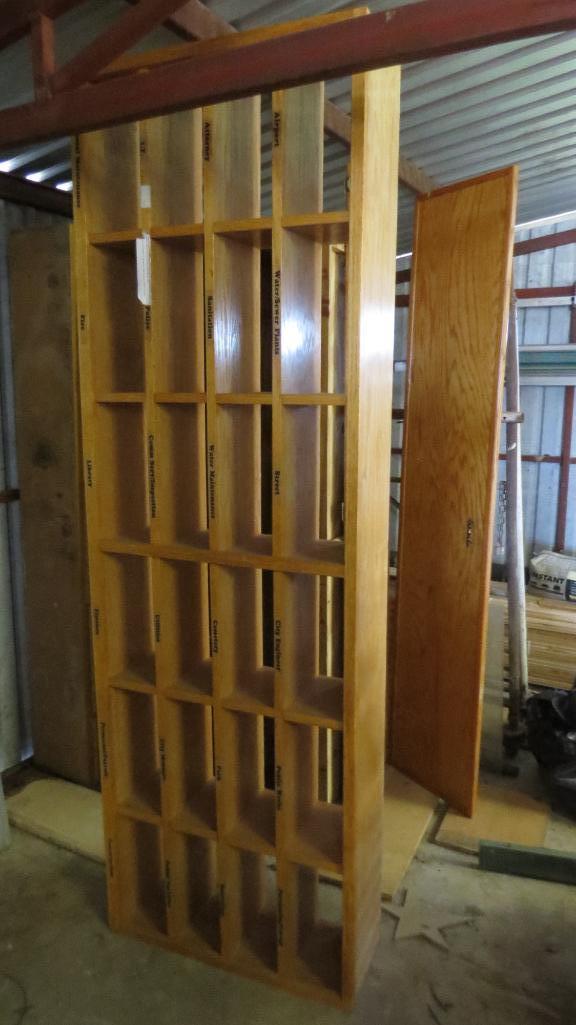 Oak mail slot cabinet.