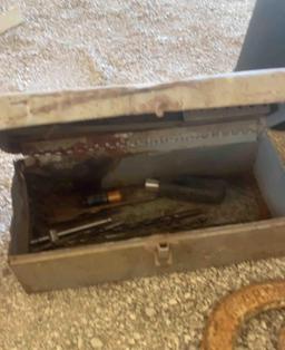 Weed preventer horseshoes metal toolbox with drillbits in it and an antique pot