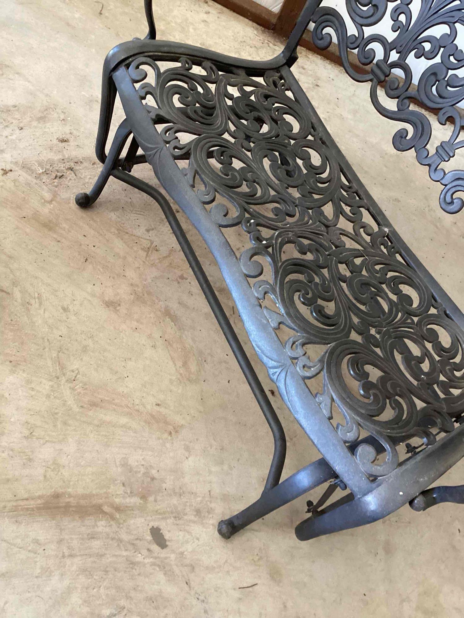 Wrought iron glider bench. Two cushions are included but it is...comfortable with or without the