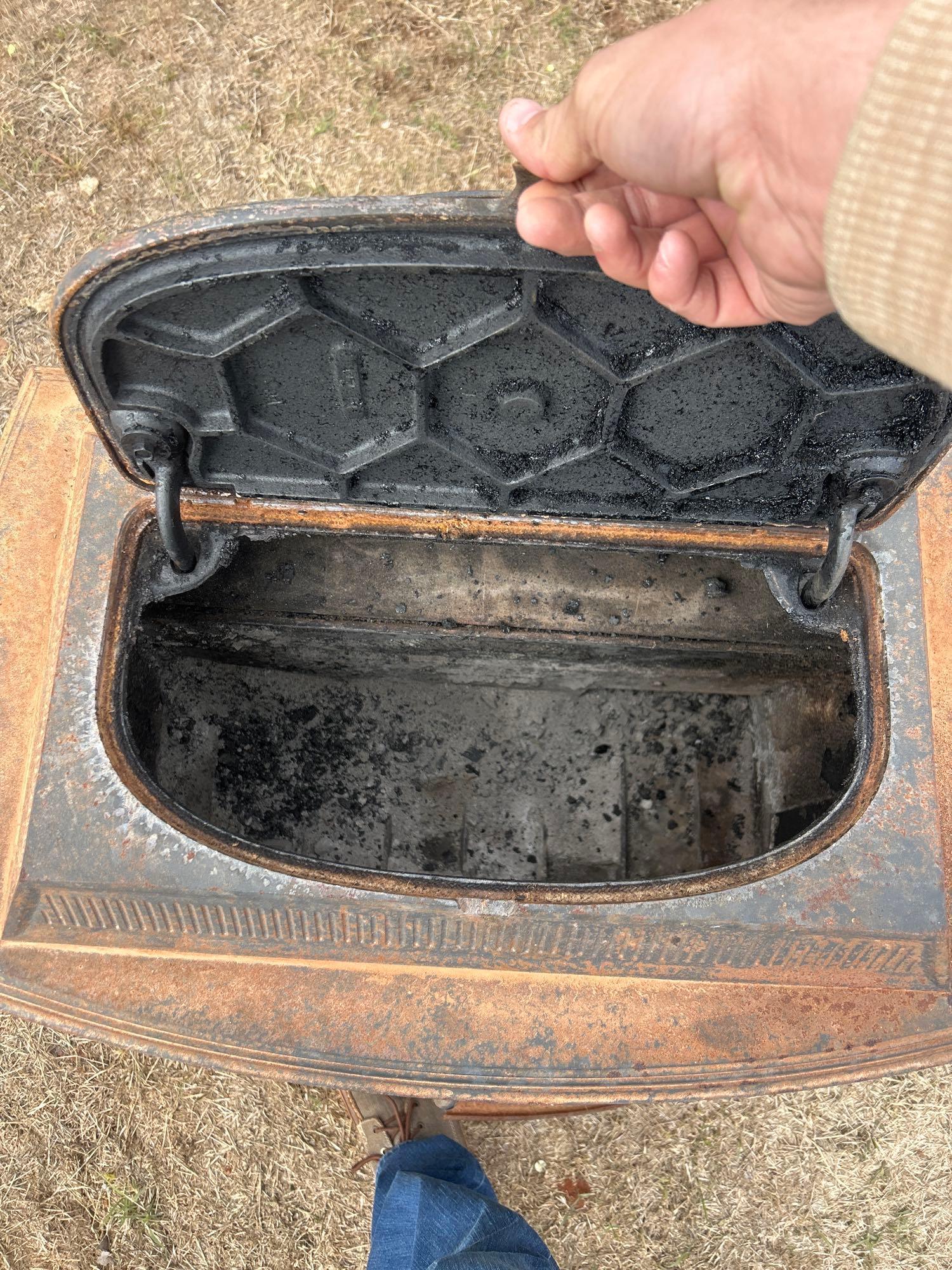 VERY HEAVY Cast iron stove, apron on front is broke