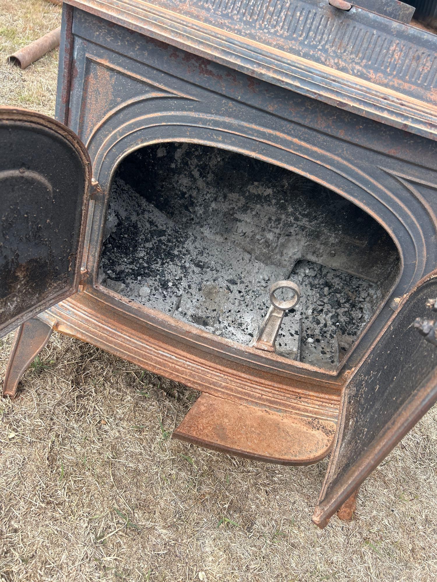 VERY HEAVY Cast iron stove, apron on front is broke