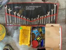 22. Standard and metric opening wrenches in pouch, staple assortment, and miter box.