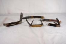 Five knives. One John Primble stockman with 2.5 inch main blade in very used condition. One Schrade