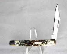 Buck Model 379 single blade pocket knife with 2.25 inch blade. Brass bolsters with simulated scales.