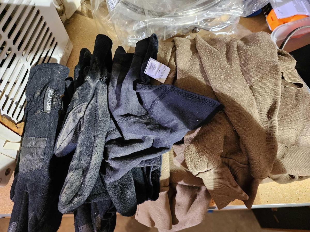 One set of used thermal underwear, and two pairs of gloves.