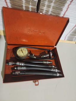 One Snap-on compression 6 pc set in original metal case. Used.