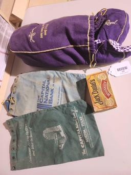 One vintage Jack Daniels whiskey matchbox, One Crown Royal bag full of Crown Royal bags and four