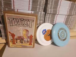 One Twixt strategy game, "like chess" in box and two Frisbee's, one World class 141g. Used.