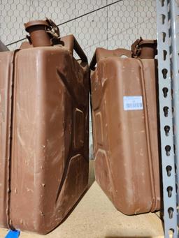 Two metal GI 5 gal gas cans. No spouts. In good condition.