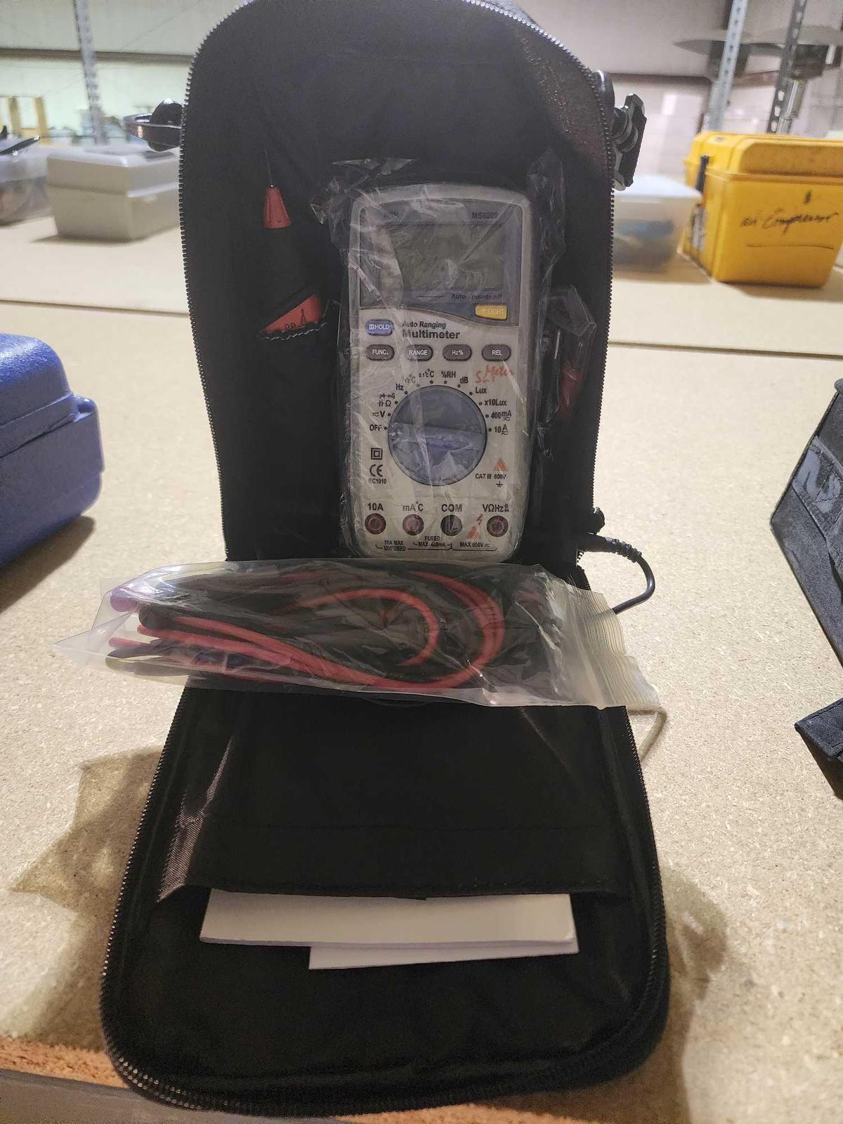 Auto Ranging multimeter in nylon case, Looks new.