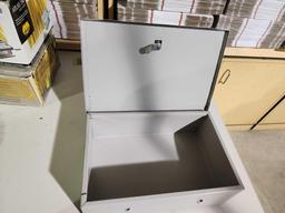 Small gray lockable with key money box. Used, in good condition.