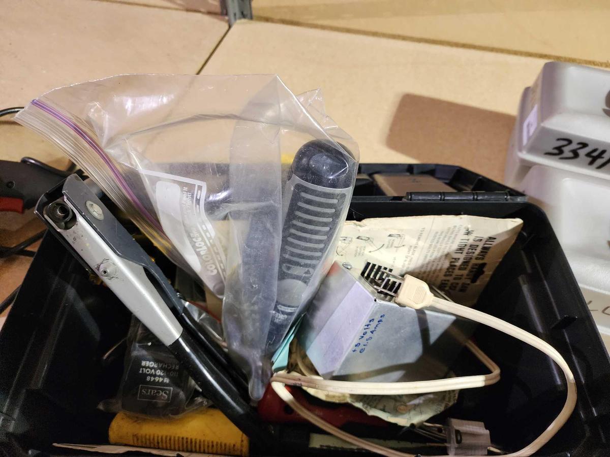 Black tool box with rivet gun, electric screwdriver, etc.