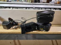 Two battery chargers for power tools and one battery.