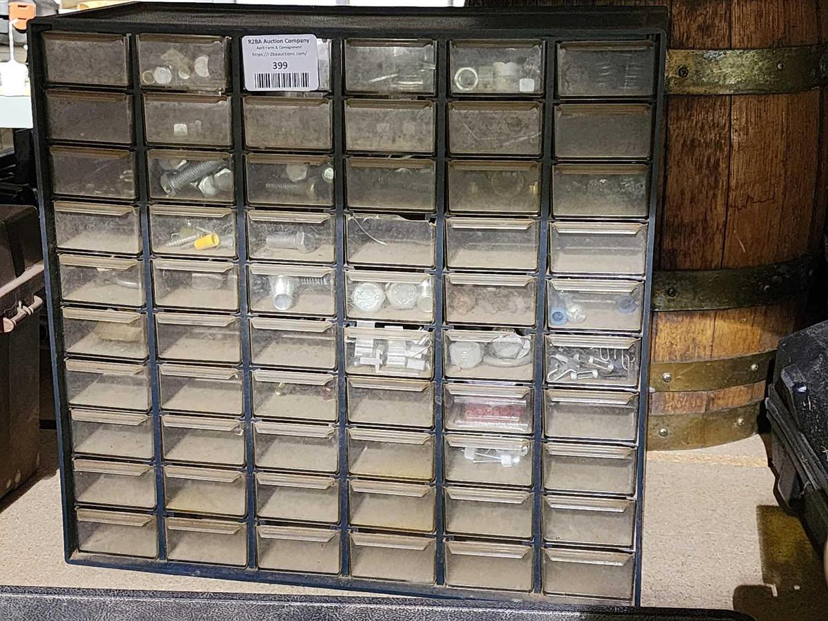 Small plastic parts cabinet. With 60 compartments with assorted bolts and nuts.