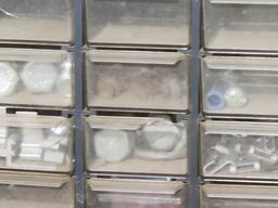 Small plastic parts cabinet. With 60 compartments with assorted bolts and nuts.