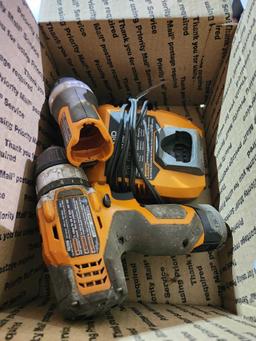 Ridgid battery 3/8" drill, impact driver and flashlight with charger and on battery. Used.
