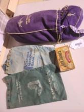 One vintage Jack Daniels whiskey matchbox, One Crown Royal bag full of Crown Royal bags and four