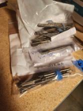 One bag of 43 taps of various sizes, most are SS in workable condition, bag of 22 SS taps, new or