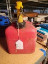 Red plastic 2 gal gas can. Used.
