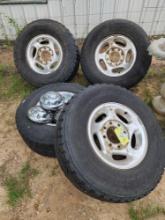 four 8 lug rims, tires and caps for Ram pickup